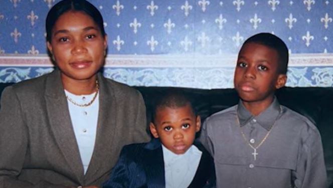 Aaron Wan-Bissaka with his elder brother Kevin and mother Elizabeth.